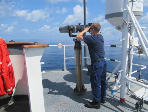 A crewmember stands Lookout watch underway. A crewmember stands Lookout watch underway.